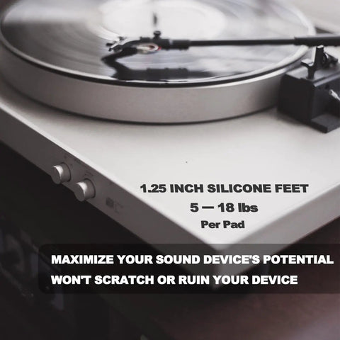 1.25 Inch Speaker Isolation Pads With Adhesive Rubber Feet Four Pack For Subwoofers Amps And Home Theater Gear on a turntable.