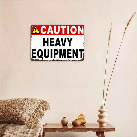 Caution Heavy Equipment Safety Sign With Funny Aluminum Wall Decor, 8x12 Inch displayed on a beige wall