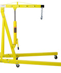 Rock Solid 2 Ton Folding Engine Hoist Hydraulic Lifting Device with yellow steel frame and six swivel casters for garage work.
