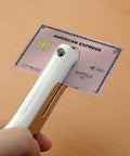 Person using Beefy Heavy Duty 1/8 Inch Single Hole Punch With Ultra Long Depth Up To 53mm on a plastic card, showing precise hole punch.