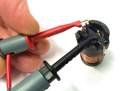 Testing a copper-wound coil with probes using the Atlas LCR40 Automatic Passive Component Analyzer Pro Grade Tool for quick auto identification.