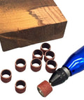 Heavy Duty Sander Drum Mandrel With Ten Badass 80 Grit Sanding Bands For Multi Material Grinding and Nail Drill Slick Rotary Accessory Set showing sanding bands and wood.
