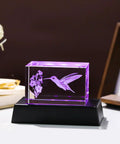 Crystal Hummingbird Laser Engraved 3D Figurine Gift For Her And Him on black LED base, purple light illuminating hummingbird pattern