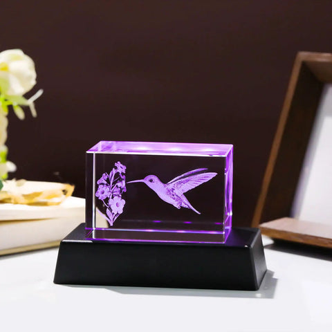 Crystal Hummingbird Laser Engraved 3D Figurine Gift For Her And Him on black LED base, purple light illuminating hummingbird pattern