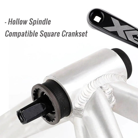 Close-up of beefy square taper bottom bracket with aluminum alloy body and chromoly spindle installed on bike frame.
