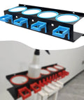Badass Cold Rolled Steel Wall Mounted Spray Bottle Holder Locks Down Four Cans For Detailing with blue hooks and jars.