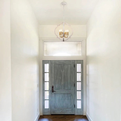 Modern Farmhouse 4 Light Wood Chandelier In Distressed White And Gold With Orb Globe Cage Pendant Lighting in foyer view