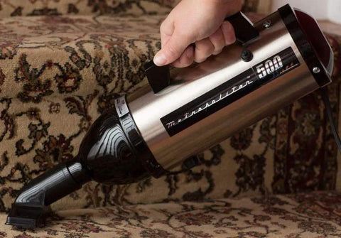 VM6SB500 500W 120V High Performance Hand Vacuum With All Steel Build Being Used on Carpeted Stairs
