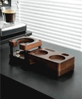 Smooth Operator Wood Espresso Tamper Station fits 51 and 58 mm baskets on a counter with non-slip base.