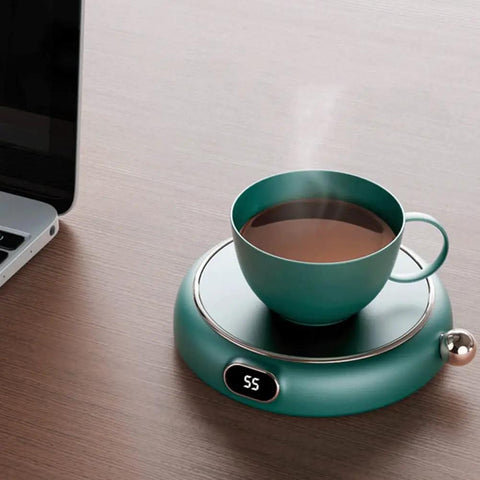Electric Coffee Mug Warmer Keeps Your Daily Brew Nice And Toasty All Day Long A Total Desk Game Changer Perfect For Hot Cocoa Tea Coffee Soup And Ceramic Mugs with steaming cup on desk.