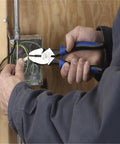 Person using Tough As Nails High Leverage Nine Inch Lineman Pliers For Cutting ACSR Screws Nails And Wire Made In USA