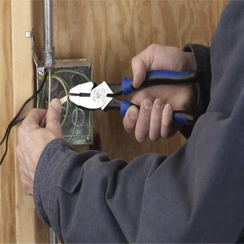 Person using Tough As Nails High Leverage Nine Inch Lineman Pliers For Cutting ACSR Screws Nails And Wire Made In USA