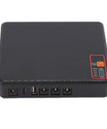 Compact Mini Ups Backup Battery Delivers Rock Solid Power To Your Modem And Router Keeping The Feed Alive When The Grid Drops Packed With A Built In 15600mAh Cell Alongside Native US Plug Support For Worry Free Setup, black design with multiple ports.