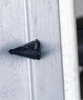 Step Drill Bit With Aluminum Titanium Nitride Coating For Long Lasting Durability drilling through metal surface shown in motion
