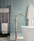 Freestanding Tub Filler Kit With Single Riser For Floor Joist Concrete Mounting in bathroom beside white tub