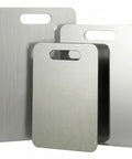 Front view: 3-piece brushed stainless steel cutting board set with integrated handles (15.3x11, 13.4x9, 11.8x7.9 in)