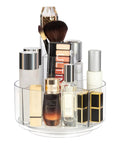 360 Degree Rotating Makeup Organizer Turntable For Vanity And Bathroom Counter Clear Spinning Cosmetic Display Case With Five Compartment Holder For Skincare, Makeup Brushes, Lipsticks And The Must-Have Accessories shown with assorted cosmetics and brushes. 