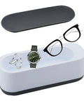 Ultrasonic Cleaner for Glasses Jewelry and Dentures Portable Small Desktop Machine with glasses, watch, and earrings inside