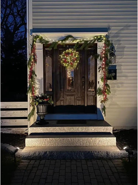 House entrance lit by 12W Outdoor Spot Lights With Transformer Hella Bright Warm White LED Landscape Lighting Kit For Yard Garden House Lawn Trees And Flags IP66 Waterproof 4 Pack For Patio Path Driveway And Christmas Lights.