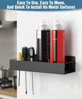 Wall-mounted steel rack holding spray cans and tools. Four Magnetic Spray Can Holders Wall Mounted Tool Rack For Garage And Workshop Easy Access Paint Oil And Cleaning Can Organizer Durable Magnet Bottle Rack For Toolbox Storage And Quick Grab.