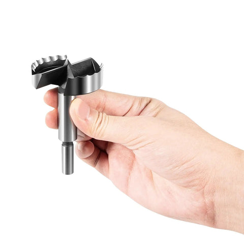 Steel Forstner bit held in hand, part of the Straight Shooting Precision Forstner Bit Set For Woodworking And Carpentry Smoothly Bores Clean Holes In Hardwood Plywood Composites 16 Piece Pro Drill Kit.