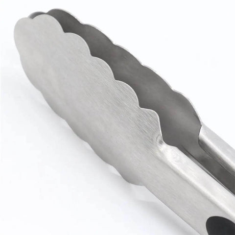 Close-up of 9-inch stainless steel kitchen tong tip from Two Pack 9 Inch And 12 Inch Stainless Steel Kitchen Tongs With Locking Mechanism Brushed Black Finish Ergonomic Grip For Grilling Sauteing And Serving