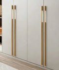 Five Pack Solid Brushed Gold Cabinet Handles For Kitchen Cabinets, Dressers And Furniture installed on white doors