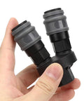 Close-up of a hand holding Durable Plastic Steel Quick Connector 2 Piece Set For C Type Round Two Way Air Fitting In Compressed Gas Systems