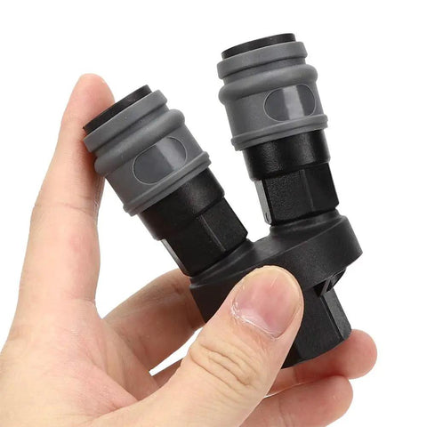 Close-up of a hand holding Durable Plastic Steel Quick Connector 2 Piece Set For C Type Round Two Way Air Fitting In Compressed Gas Systems