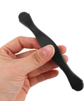 Hand holding a single black metal handle from Black Kitchen Cabinet Hardware Pulls 10 Pack Modern Drawer Handles Replacement for Cabinets Furniture Cupboards and Doors Sleek Boss Pulls for Dressers and Cabinet Doors with Easy Install.