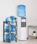 Beefy Heavy Duty 5 Gallon Water Bottle Rack With Detachable 3 Tier Stand for Home and Office next to a water cooler