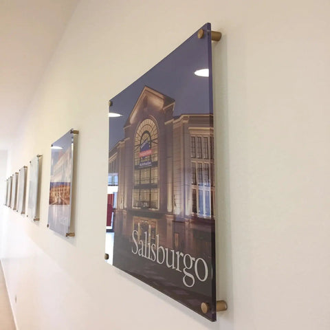 Dead Simple To Install, Rock Solid Aluminum Wall Spacers And Standoff Screws For Acrylic Signs on a wall with sleek black finish.