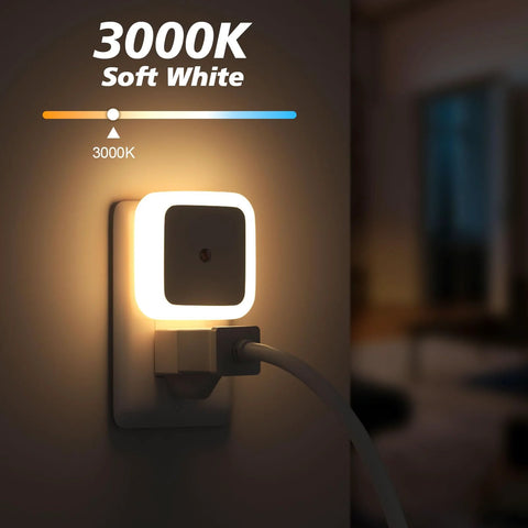 Sujeet square plug-in night light with warm white LED border plugged into wall outlet.