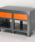 Heavy Duty Steel Workbench For Garage And Auto Shop Tough As Nails Industrial Maintenance Bench with two orange drawers.