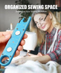 Person holding 3 In 1 Needle Threader And Seam Ripper For Sewing Machines with alignment guide, magnetic back, built-in ruler