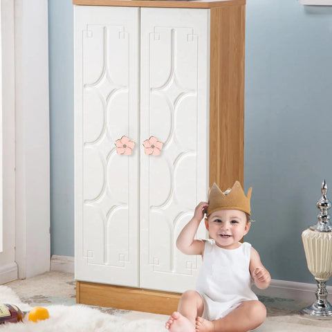 Child smiling in front of cabinet with 4 Piece Pink Petal Drawer Knobs With Bling Centers Spark A Major Bedroom Glow Up Solid Zinc Alloy Cabinet Hardware For Dresser And Closet Upgrade Top Notch Girls Room Decor.