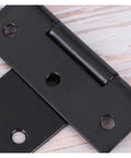 Close-up of Beefy Heavy Duty T Shape Door Hinges With Screws 2 Inch Black Iron Wrought Hardware showing pre-drilled holes.