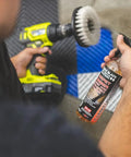 Person using Carpet Bomber Upholstery Cleaner Citrus Power That Lifts Grease Dirt And Odors Tough Grime Be Gone Safe On Fabrics