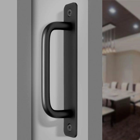 Close-up of heavy duty black barn door handle on a flat surface, featuring aluminum material and smooth grip design for easy use.