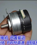 Brushless Servo Motor With PWM Speed Control For DC 9V To 24V 100 Line Encoder Built In Drive held in hand, side view