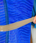 Close-up of blue quilted Four Pack Heavy Duty Moving Blankets For Furniture Protection Quilted Padding 72 By 80 Inches Blue