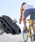 Aluminum Alloy Bicycle Seatpost Head Clamp For Seatpost And Saddle Tube Tough As Nails Rust Resistant Strong Seat Clamp Head For Bikes Replacement Part 1 Piece Black shown next to cyclist on yellow bike.