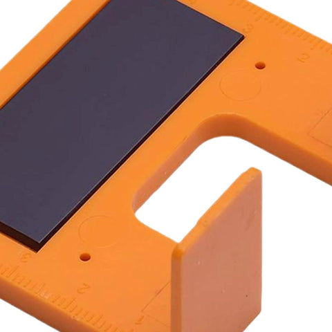 Close-up of Magnetic Hinge Jig With Precise Adjustable Clamps for cabinet doors and deck installations, orange ABS body.