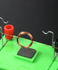 Electric Motor Model And Electromagnetic Swing Kit For Classroom Learning, showing copper coil and connectors on green base.