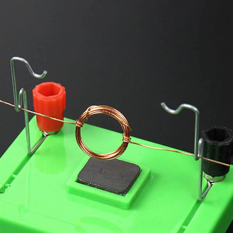 Electric Motor Model And Electromagnetic Swing Kit For Classroom Learning, showing copper coil and connectors on green base.