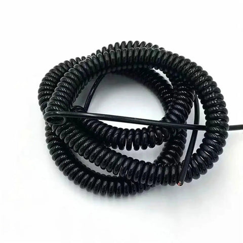 Badass Stretchy Coil Extension Cord With Heavy Duty Spiral Spring Design Hella Flexible Telescopic Power Wire Expanding Fifty Foot Range For Trucks And Shop Tools coiled up for easy storage.