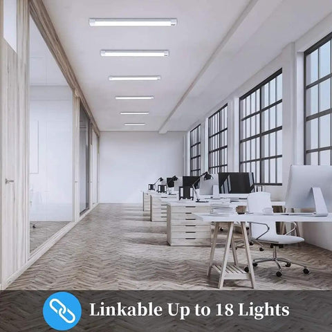 Bright 5000K LED Ceiling Light Fixture IP66 Waterproof 4ft Plug In Tube Light illuminating modern office space