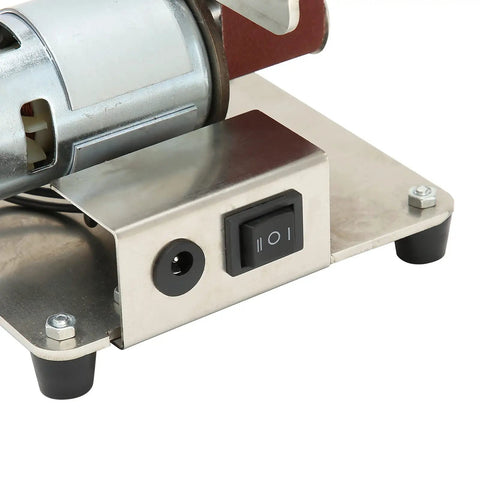 Close-up of Jauarta Mini Belt Sander With Aluminum Alloy Body control panel and motor, ideal for polishing and grinding.