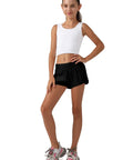 Girl wearing Girls Athletic Shorts With Liner Quick Dry Lightweight Running Shorts For Active Workouts Built In Mesh Liner With Zip Pocket Black