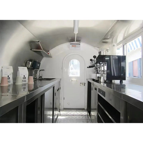 Interior view of Custom Built Food Trailer With Flexible Layout Designed To Hit The Road For Busy Markets And Festival Vendor Lots Featuring Kickass Prep Space And Smooth Tow Setup For Hustling Grill Masters with stainless steel countertops.
